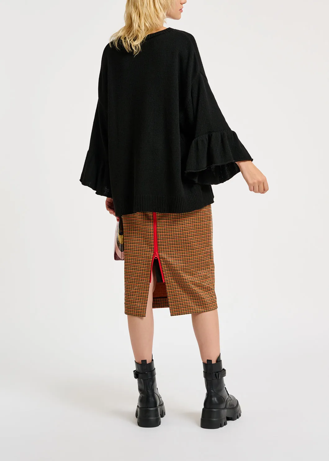 Black knit sweater with ruffled cuffs