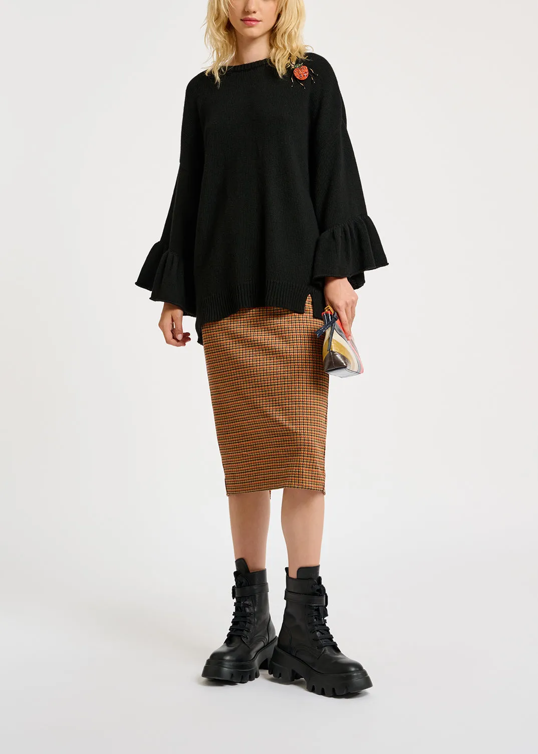 Black knit sweater with ruffled cuffs